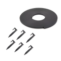 Black plastic strip with circular component and six stakes on a white background