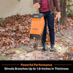 Person using a LawnMaster leaf shredder in an outdoor setting with leaves on the ground.