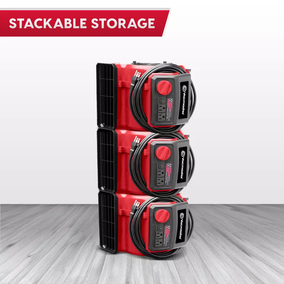 Stackable storage units with cables on a gray floor and white background