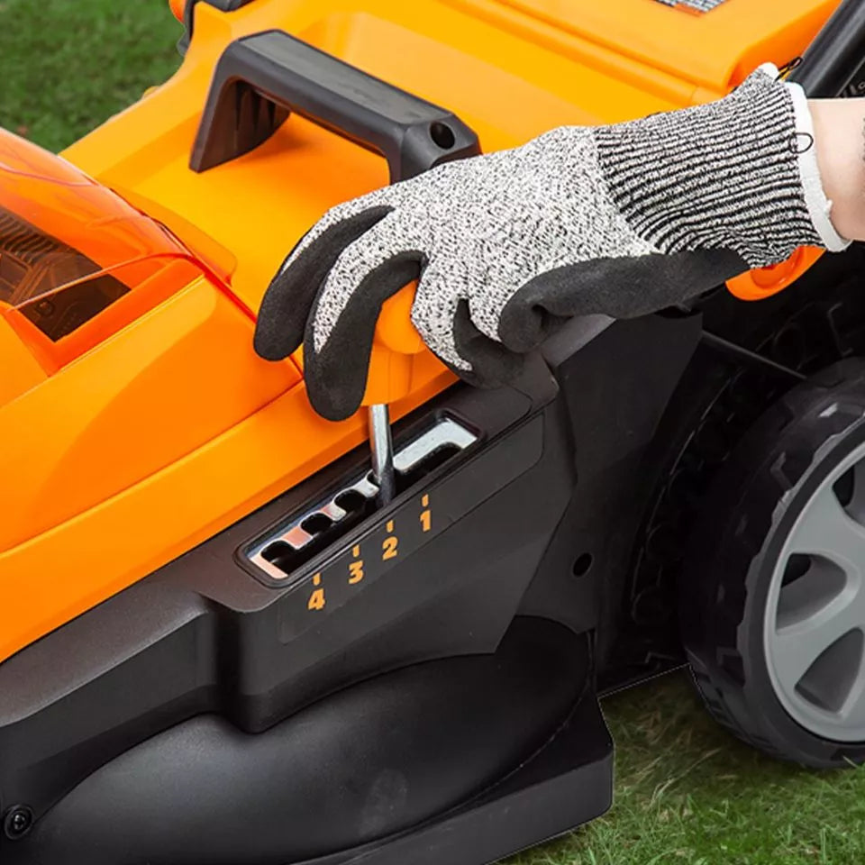 Person wearing a cut-resistant glove adjusting settings on an orange lawn mower.