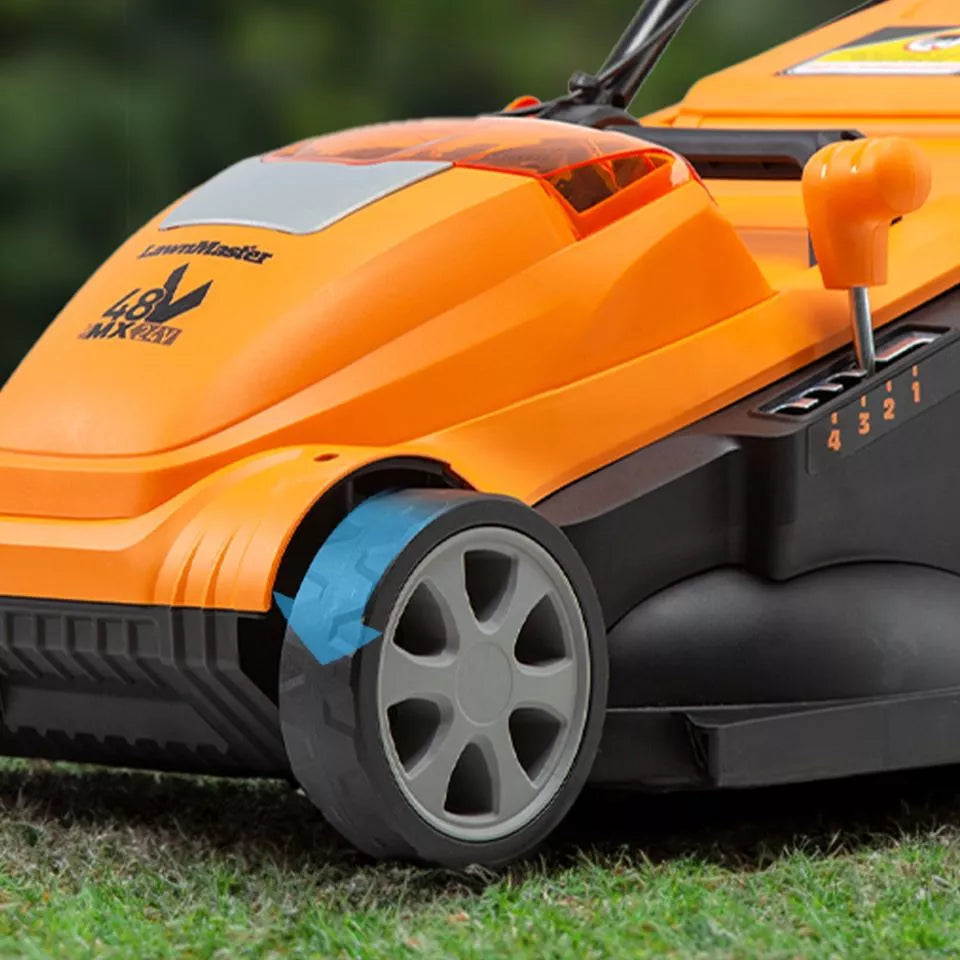 Orange and black lawn mower on grass