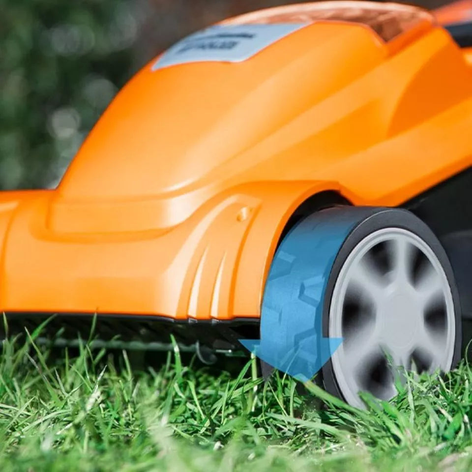 Orange robotic lawn mower on grass