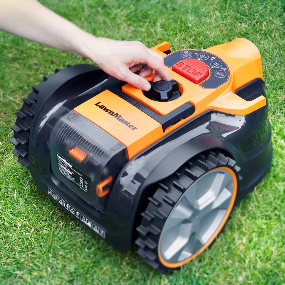 Robotic lawn mower with 'LawnMates' branding on a grassy surface.