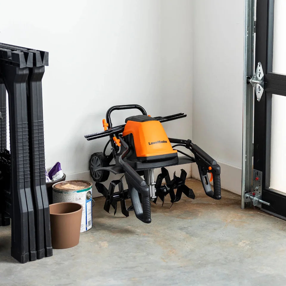 Orange and black tiller in a garage setting