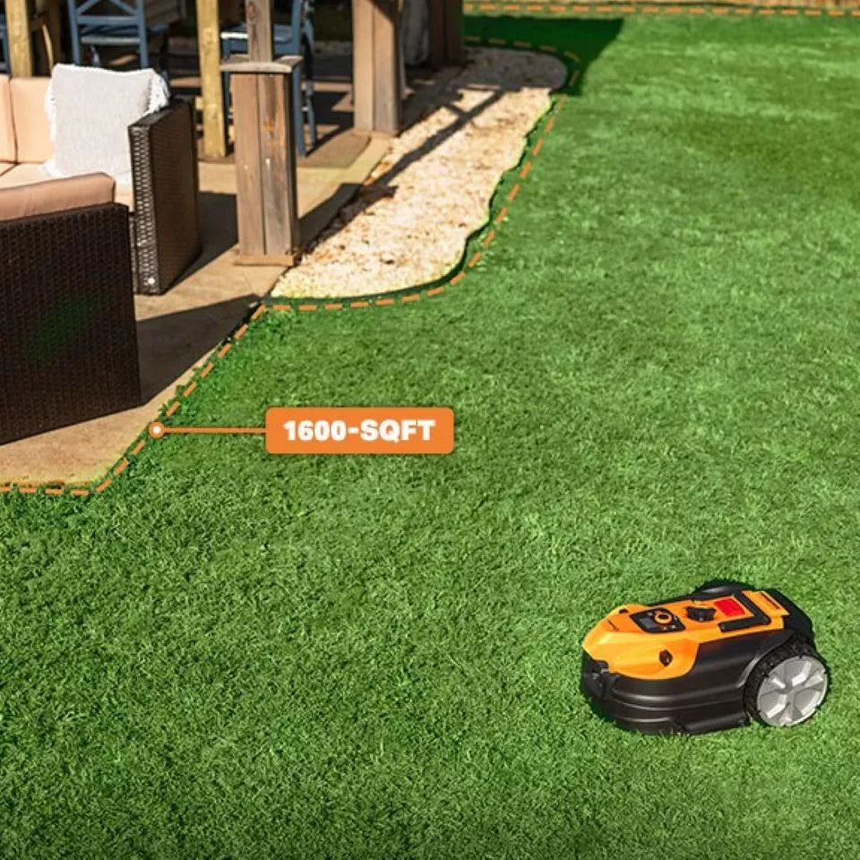 Robotic lawn mower on grass with '1600-SQFT' label in a backyard setting.