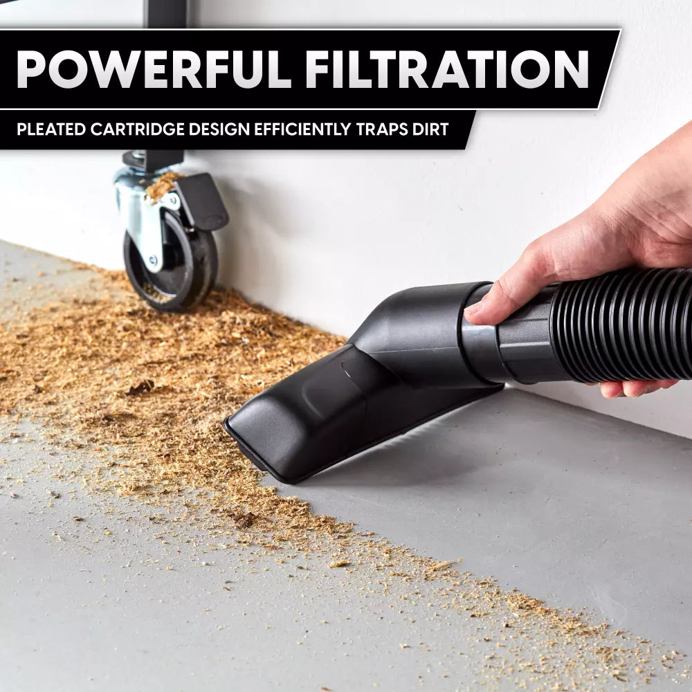 Hand using a vacuum cleaner to collect dirt on a surface with text about powerful filtration.